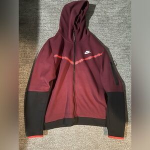 Black and red Nike tech jacket